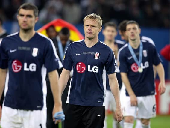 Aaron Hughes, Damien Duff and Chris Baird look dejected after the game