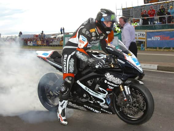 Bruce Anstey celebrates his treble at the 2007 NW200 with a burnout.