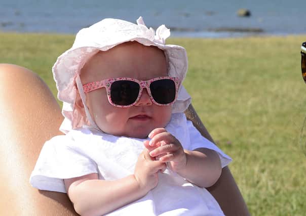 Little Rita Sullivan from Belfast pictured enjoying the sunny weather at Seapark beach near Holywood in 2018.
 Picture By: Arthur Allison.