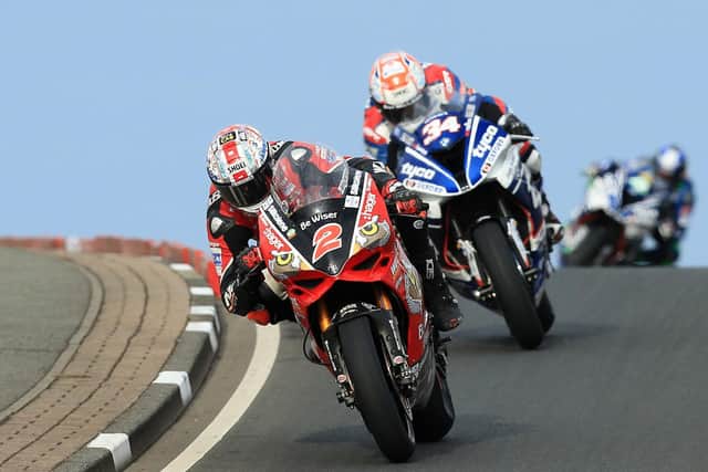 Glenn Irwin leads Alastair Seeley in the main Superbike race at the 2017 North West 200.