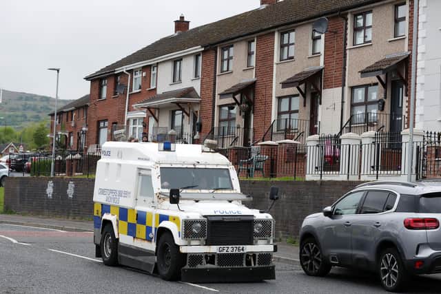 General view of PSNI officers at the scene of a shooting in Lenadoon Avenue, west Belfast
