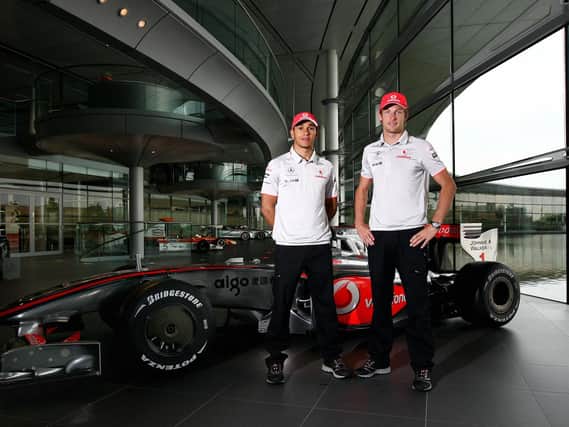 Lewis Hamilton and Jenson Button pose for a picture