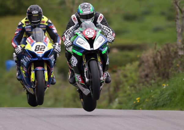 Michael Sweeney and Derek Sheils in action during practice at the Cookstown 100 last year.
