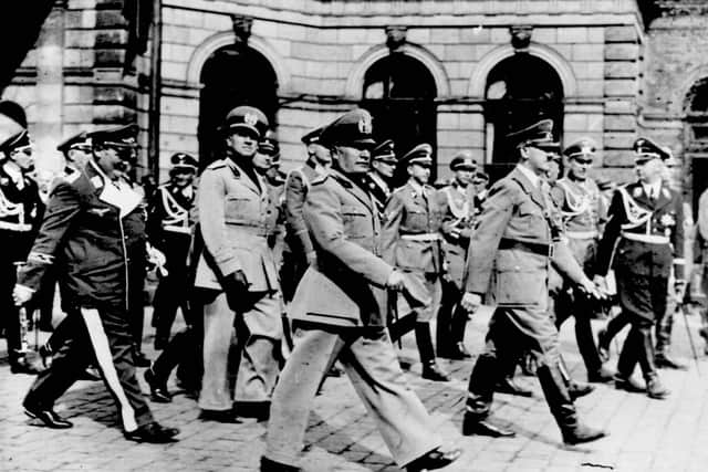 Benito Mussolini, foreground, and Adolf Hitler had signed the 1939 Pact of Steel yet Italy had not joined Germany in the war by May 1940. Some believe that Mussolini equivocated to assess who was more likely to win the conflict but the real reason was the information he got from Tyler Gatewood Kent!