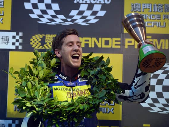 Simon Andrews celebrates his third place finish at the Macau Grand Prix in 2012.