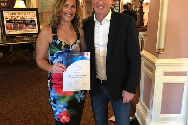 Alison receiving her UEFA Pro Licence from Michael O'Neill