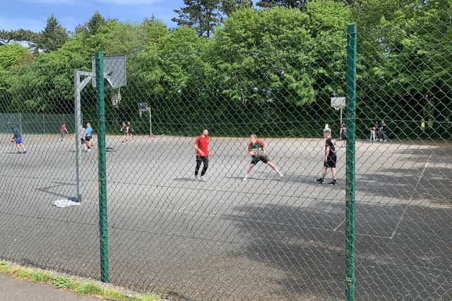 Unofficial sporting matches taking place in Belfast. There is no suggestion that anyone here is doing anything wrong,but having an official cricket match will be harder