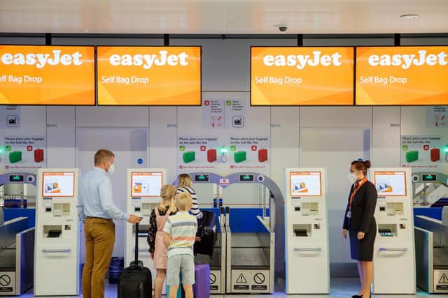 Photo issued by EasyJet of new bio security measures taking place at an EasyJet checkout counter, as the low-cost carrier is to resume flights from a number of UK airports from June 15