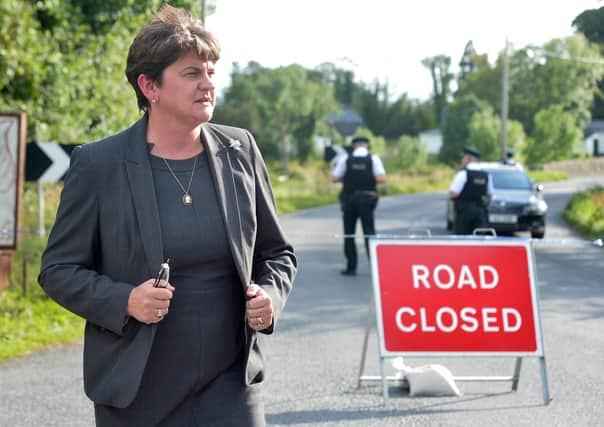 First Minister Arlene Foster at the scene of a CIRA bomb blast at Wattle Bridge in Co Fermanagh last August. 
Picture: Colm Lenaghan/Pacemaker