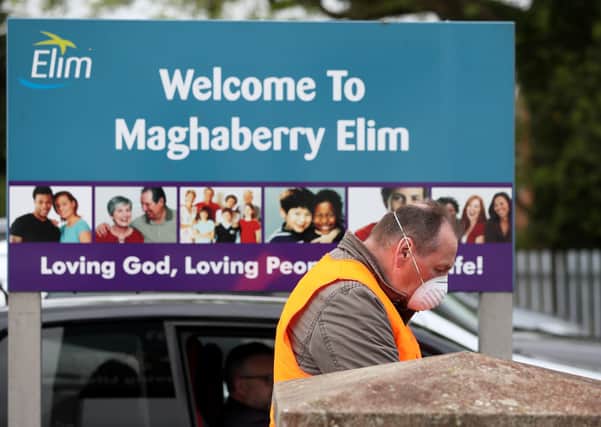 Keith Kidd, a deacon at Maghaberry Elim Pentecostal Church, Craigavon, bows his head in prayer during a drive in service as a number of churches are restarting drive-in services following the easing of restrictions in Northern Ireland due to coronavirus pandemic