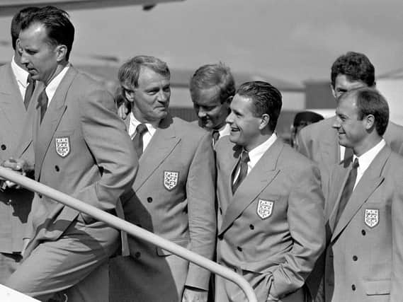 England Manager Bobby Robson (2nd left) shares a joke with player Paul Gascoigne (3rd left) leaving Luton to fly to Italy for the World Cup