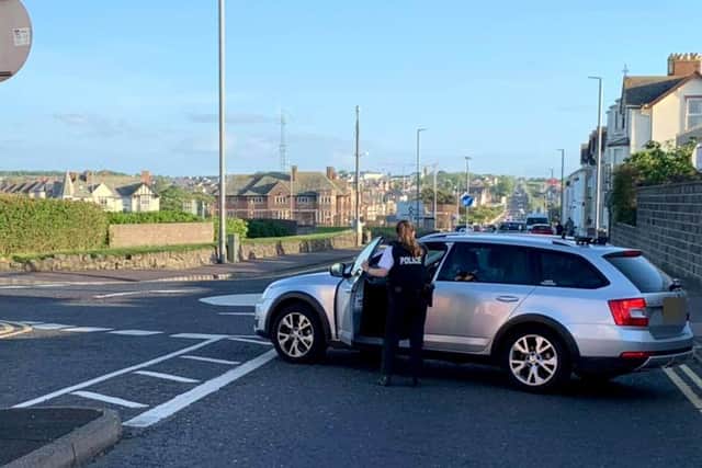 Police close roads into Portrush on Sunday evening after an influx of visitors to the town. Pic McAuley Multimedia