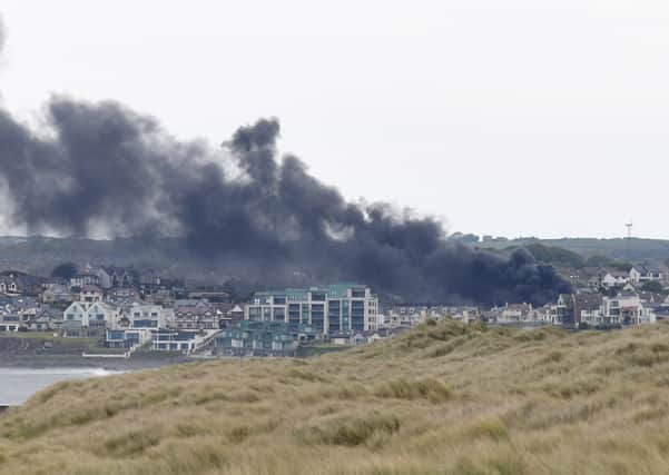 25/5/20: Smoke blows over Portstewart today from a house fire. Picture: Michael Cooper