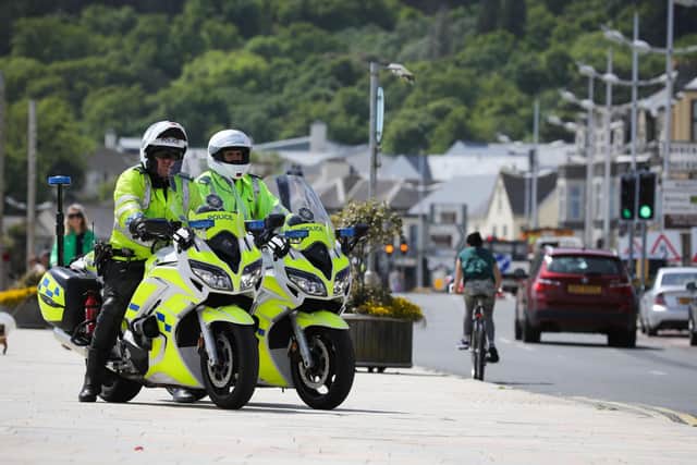 PSNI officers on patrol on Main Street, Newcastle, County Down during Bank Holiday Monday which saw a small number of people travelling to the seaside resort