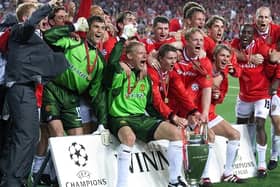 Manchester United celebrate after winning the European Cup in Barcelona, beating Bayern Munich 2-1. Pic by PA.