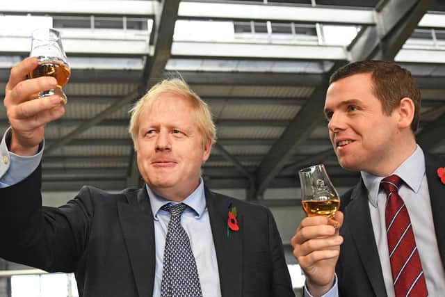 Prime Minister, Boris Johnson, and Douglas Ross MP, who has resigned from the cabinet over the Dominic Cummings row. (Photo: PA Wire)