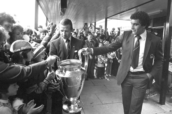 Nottingham Forest's John McGovern and goalkeeper Peter Shilton (right) show supporters the European Cup at East Midland's Airport, after their 1-0 victory in the 1980 final over Hamburg in Madrid, Spain. Pic by PA.