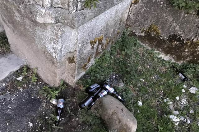 Beer bottles have been discarded at the castle.