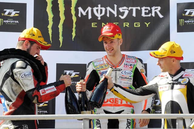 Race winner Ian Hutchinson with runner-up Michael Dunlop (left) and Keith Amor.