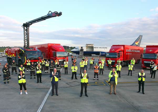 Managing Director Graham Keddie recently joined politicians to show support for teams working 24/7 at the airport to keep essential supply lines open.