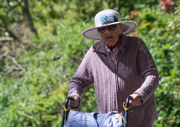Former nurse Joan Rich, 101, walks through Allenby Park in Felixstowe, Suffolk, to raise money for NHS Charities Together. Picture: Joe Giddens/PA Wire