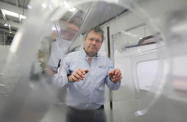Michael Knight, Managing Director of Donite Plastics in Saintfield Co Down with a prototype medical device that protects health workers from viral aerosol infection.  PA Photo. Picture date: Thursday May 28, 2020. The clear one-piece head box developed by Knight shields clinical staff when they are performing procedures that result in patients expelling aerosol spray. See PA story HEALTH Coronavirus Ulster Box. Photo credit should read: Niall Carson/PA Wire