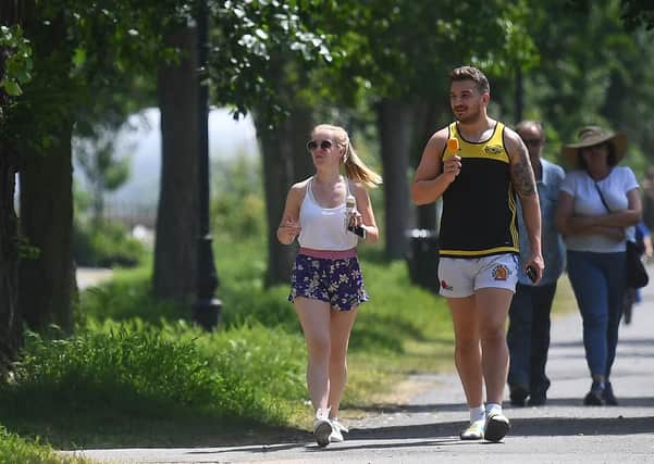 People enjoy the hot weather on Clapham Common, London, this week. Parks should never have closed, so people who live in flats with no outside space enjoy some of the escape that people with gardens have had in this fine weather, writes Ben Lowry