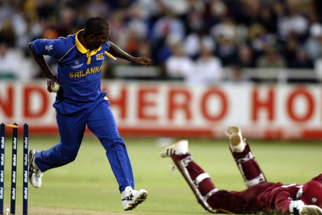 Mervyn Dillon of the West Indies is run out by Pulasthi Gunaratne of Sri Lanka during the ICC Cricket World Cup 2003 Pool B match in Cape Town
