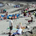 Crowds of sunbathers were enjoying the sunshine at Ballygally beach in Co Antrim at the weekend