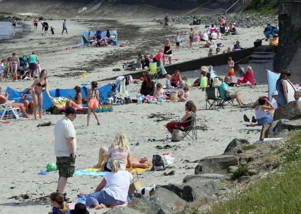 Crowds of sunbathers were enjoying the sunshine at Ballygally beach in Co Antrim at the weekend
