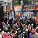 Orangemen take part in Twelfth of July parades as they make their way to the field at Shaws Bridge, Belfast