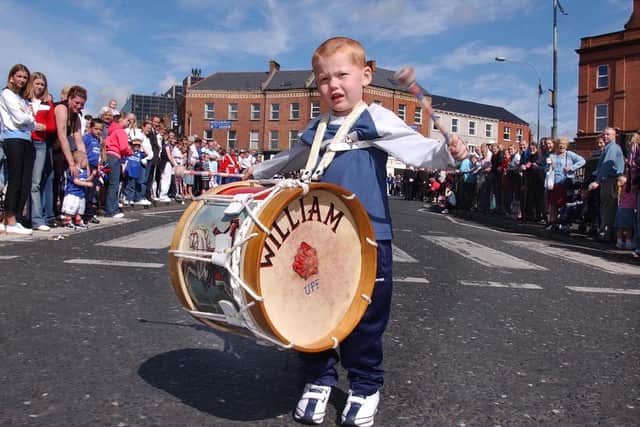 PACEMAKER, BELFAST, 12/7/2002: Young drummer boy joins bands marching at the 12th parade in Belfast this morning .