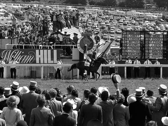 Walter Swinburn, 19, takes Shergar past the finishing post at Epsom to win the 202nd, and his first, Derby Stakes. Shergar took the race by ten lengths