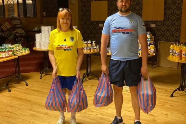 Lyn Kernohan and Gary Peoples kitted out in Ballymena FC strips.