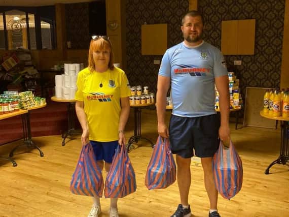 Lyn Kernohan and Gary Peoples kitted out in Ballymena FC strips.