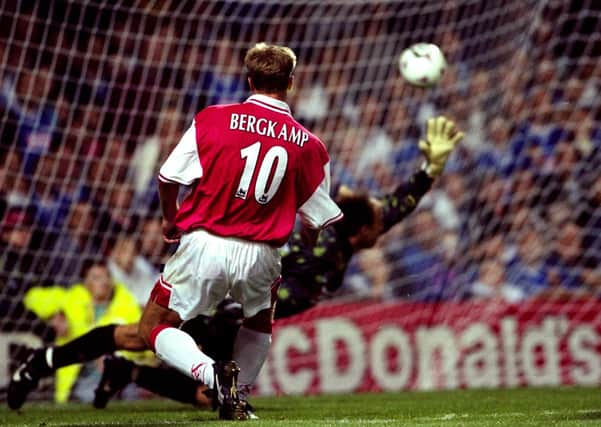 Arsenal’s Dennis Bergkamp beats Kasey Keller in the Leicester City goal during his 1997 hat-trick. Pic by Getty.
