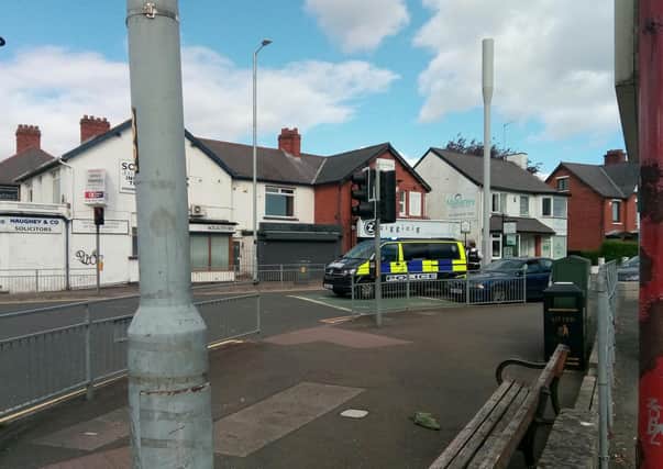 Police are diverting traffic in Finaghy.