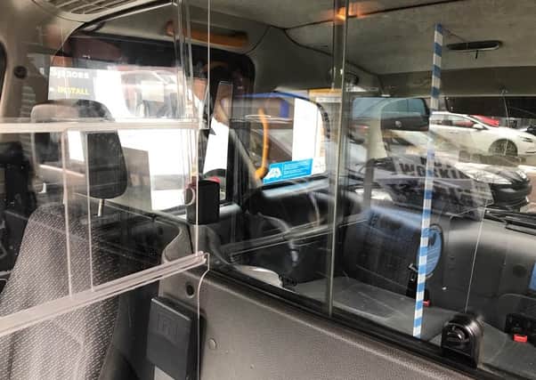 Undated handout photo issued by Belfast Taxis CIC of safety measures, including perspex screens, that have been installed to protect both drivers and passengers in their cabs holder.