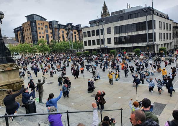 People take part in a Black Lives Matter protest rally in Custom House Square, Belfast on Saturday, in memory of George Floyd who was killed on May 25 while in police custody in the US city of Minneapolis. Photo: Rebecca Black/PA Wire