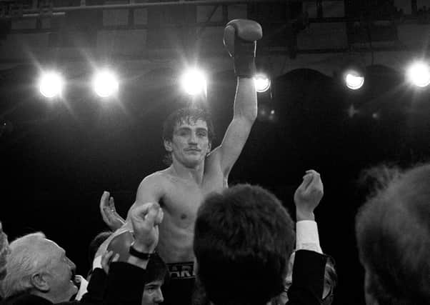 Boxer Barry McGuigan in 1985 celebrates after beating champion Eusebio Pedroza during the World Featherweight Championship at Loftus Road Stadium in London. Pic by PA.