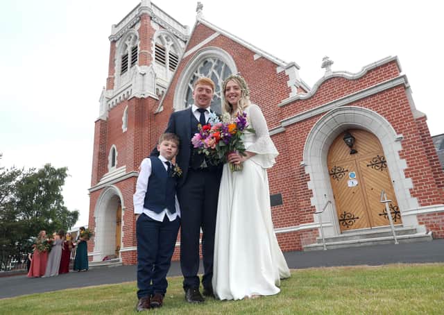 Paddy and Rebecca Smyth finally tied the knot on the fourth attempt at Cregagh Presbyterian church in east Belfast on Monday. Joined by their six year old son Reuben, the couple's marriage was finally possible after an easing of the Coronavirus restrictions that now allows for small outdoor wedding ceremonies. PICTURE BY STEPHEN DAVISON