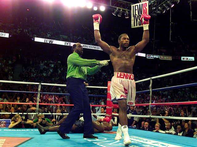 Lennox Lewis lifts his arms in victory after beating Mike Tyson at the Pyramid Stadium, Memphis, with an 8th round knockout