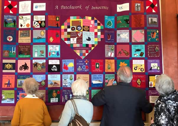 A SEFF memorial quilt telling stories of Troubles victims on display at Stormont in 2017.