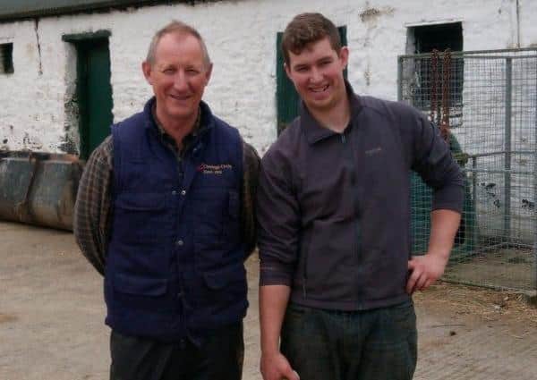 Father and son David and Gordon Crockett in their farmyard on the Londonderry side of the border