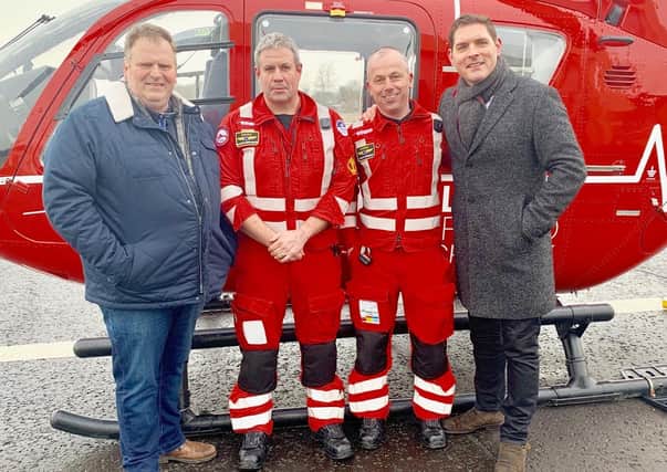 Andrew Trotter and Malachi Cush with Air Ambulance personnel