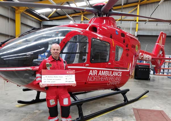 The team at Vivo Ballyrobert have helped fundraise £1,105 for Air Ambulance NI. Glenn O’Rorke from Air Ambulance NI is pictured accepting the generous donation.