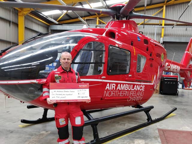 The team at Vivo Ballyrobert have helped fundraise £1,105 for Air Ambulance NI. Glenn O’Rorke from Air Ambulance NI is pictured accepting the generous donation.