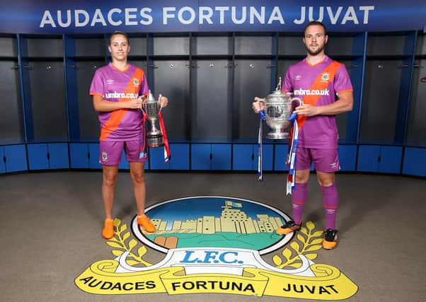 Linfield launched their new Unbro away kit for the start of the 2020/2021 season last week. 
Ladies player Kelsie Burrows and Linfield club captain Jamie Mulgrew pictured at Windsor Park. Picture Pacemaker