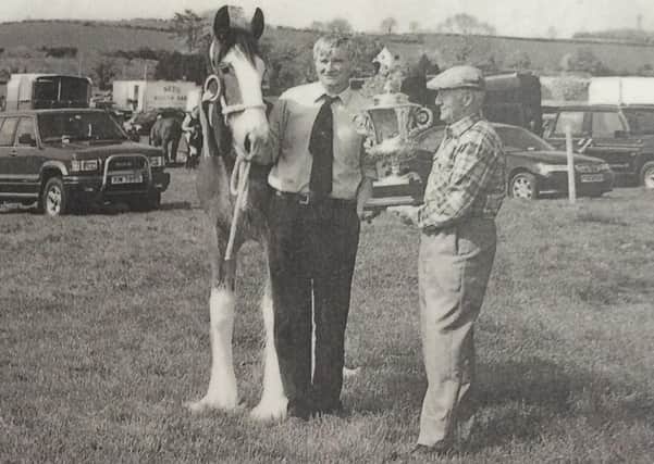 Pictured in 2000 is John Drummond and Bratlach Sophie who received the Carr Cup for the champion Clydesdale at the Killyleagh Show. Picture: Killyleagh Show