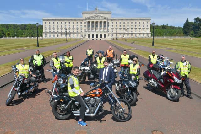 Health Minister Robin Swann (centre) thanked a group of volunteer bikers who have covered the equivalent of a lap around the world delivering food and medicine across Northern Ireland during the pandemic. Jamie Watson, 14, from Stranocum who has made over 700 face shields, joined the minister at Stormont along with Philip Johnston and other members of the Volunteer Bikers Group